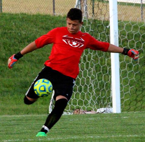 Senior goal keeper Bayron Lobo-Zelaya kicks ball out into the field.