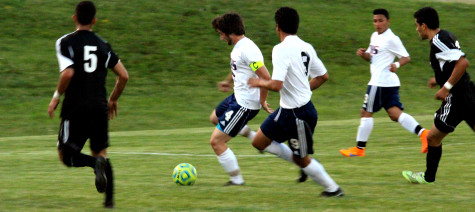 Senior captain Jackson Taylors gets ready to pass ball to senior Carlos Pulido.