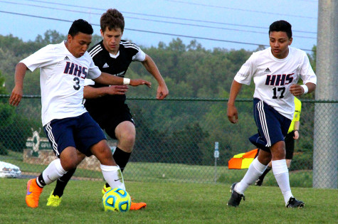 Junior Jetzon Matute-Jarquin dribbles the ball away from TA player.