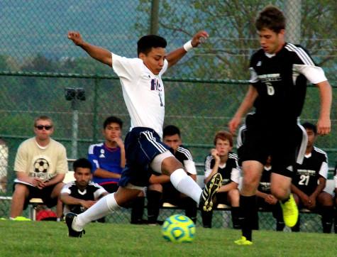 Junior Mario Murillo-Velasquez attempts to kick the ball away from TA player.
