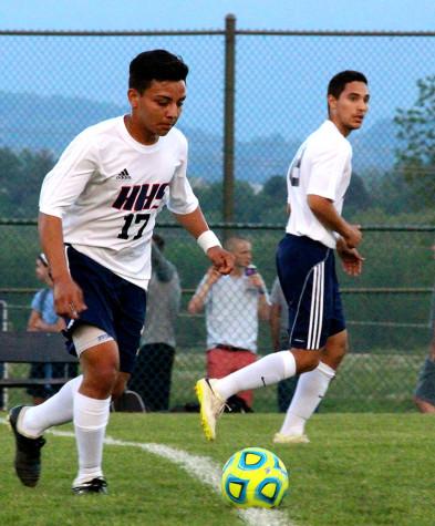 Junior Mario Murillo-Velasquez passes the ball to another player.