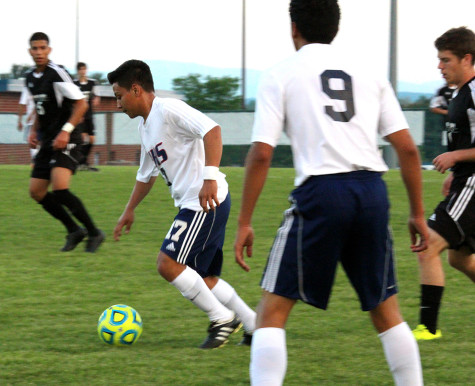 Junior Mario Murillo-Velasquez and Senior Carlos Pulido protect the ball from other TA players.