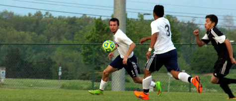 Junior Parker Strickler defends the ball from a TA player.