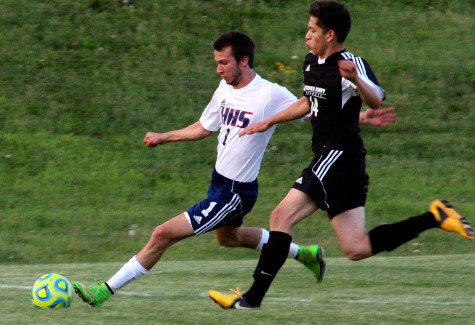 Junior Parker Strickler kicks the ball away from a TA player.