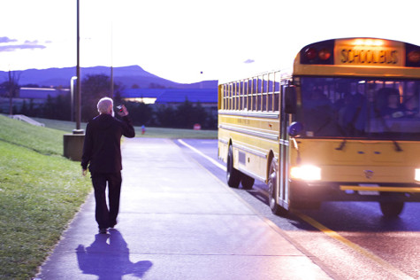 Principal Eye greets one of the first busses.