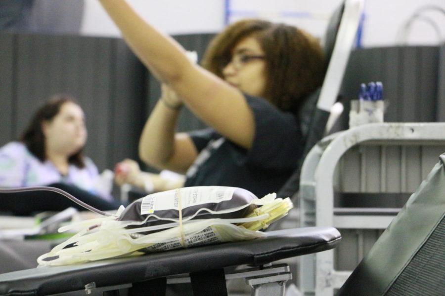 Senior+Ayianna+Jackson+sits+beside+a+pint+of+blood+as+she+cleans+her+arm+off+after+her+fourth+time+giving+blood+in+three+years.