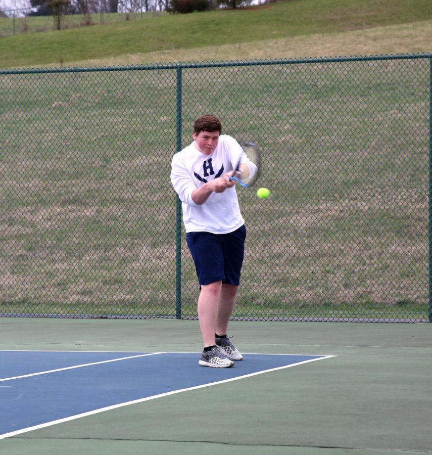Junior+Tobias+Yoder+steps+up+and+returns+a+low+shot+from+Turner+Ashby%27s+Canon+Secord+during+his+doubles+match.