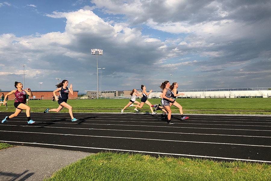 Seniors+Carissa+Roberts+and+Sydney+Harper+and+freshman+Elena+Luhn+run+the+100+meter+dash.+Roberts+reflects+on+what+made+her+last+season+great.+%22It+was+definitely+the+friends.+I%E2%80%99ve+also+gotten+some+great+tan+lines%2C+so+that%E2%80%99s+amazing.+I+love+my+relays+and+I+love+running+well%2C%22+Roberts+said.+%0A